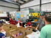 Macon county sheriff and local baseball team assist with food distribution for families in need