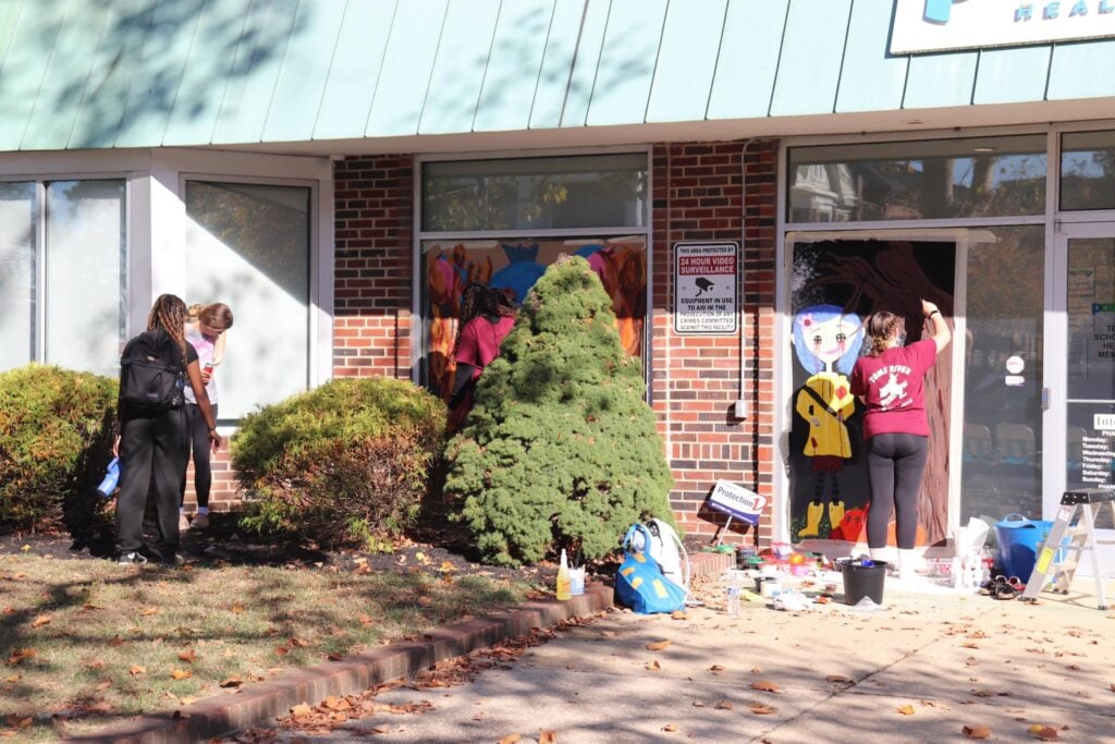 Toms River students paint downtown storefronts for 85th annual Halloween parade