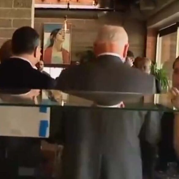 Tim walz, doug emhoff walk away without paying for order at coffee shop - photo licensed by shore news network.