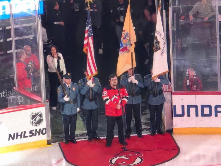 Brick township police honor guard presents colors at new jersey devils game - photo licensed by shore news network.