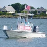 Bethany Beach, Delaware, U.S.A - August 3, 2024 - A fishing boat with Vote Trump sign on the bay near Indian River Inlet