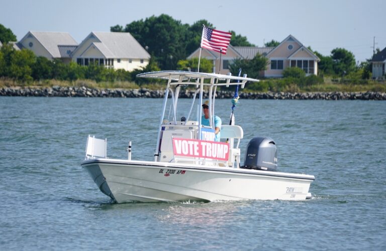 Bethany Beach, Delaware, U.S.A - August 3, 2024 - A fishing boat with Vote Trump sign on the bay near Indian River Inlet