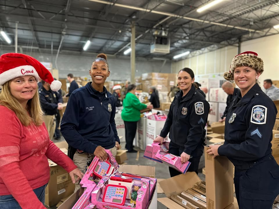 Santa’s police helpers sort toys for children in Anne Arundel County