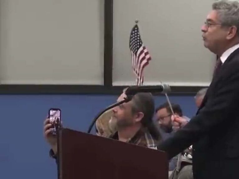 Lawyer from new jersey's top legislative democrat's firm spearheaded removal of citizen holding american flag at raritan town council meeting - photo licensed by shore news network.