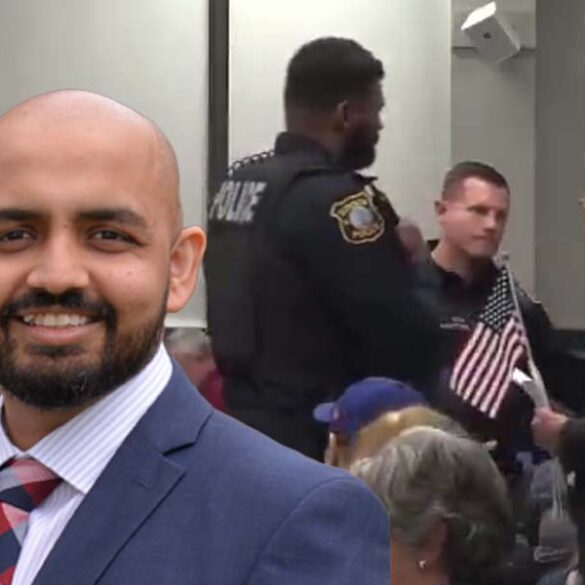 New jersey lawyer forcibly removed from town hall meeting by police for displaying small american flag - photo licensed by shore news network.
