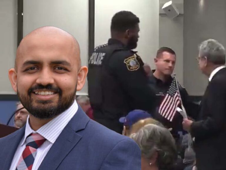 New jersey lawyer forcibly removed from town hall meeting by police for displaying small american flag - photo licensed by shore news network.