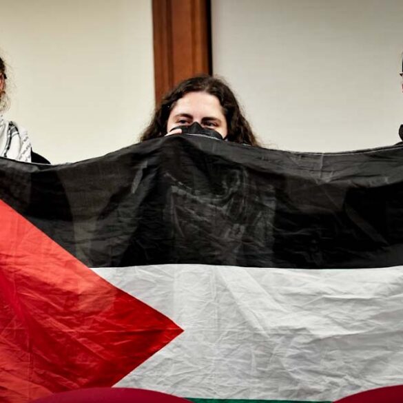 Protesters ejected from middletown council meeting after singing ceasefire carols - photo licensed by shore news network.