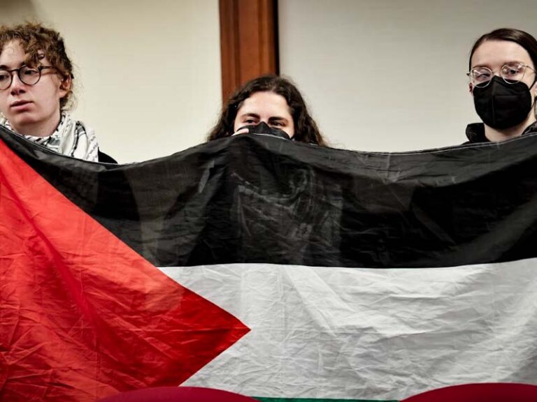 Protesters ejected from middletown council meeting after singing ceasefire carols - photo licensed by shore news network.