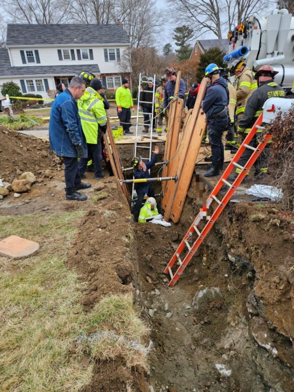 Stamford firefighters rescue worker from trench collapse Stamford firefighters rescue worker from trench collapse