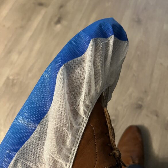 Bill spadea shows off his new shoe protectors for trump inaugural coverage - photo licensed by shore news network.