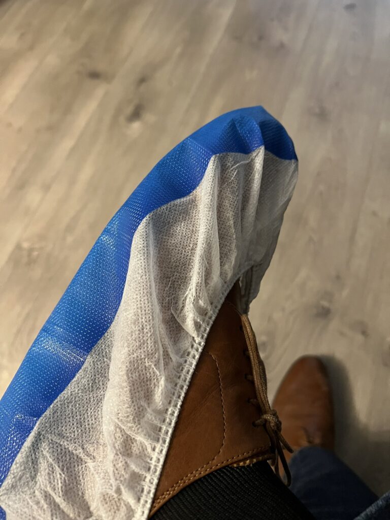 Bill spadea shows off his new shoe protectors for trump inaugural coverage - photo licensed by shore news network.