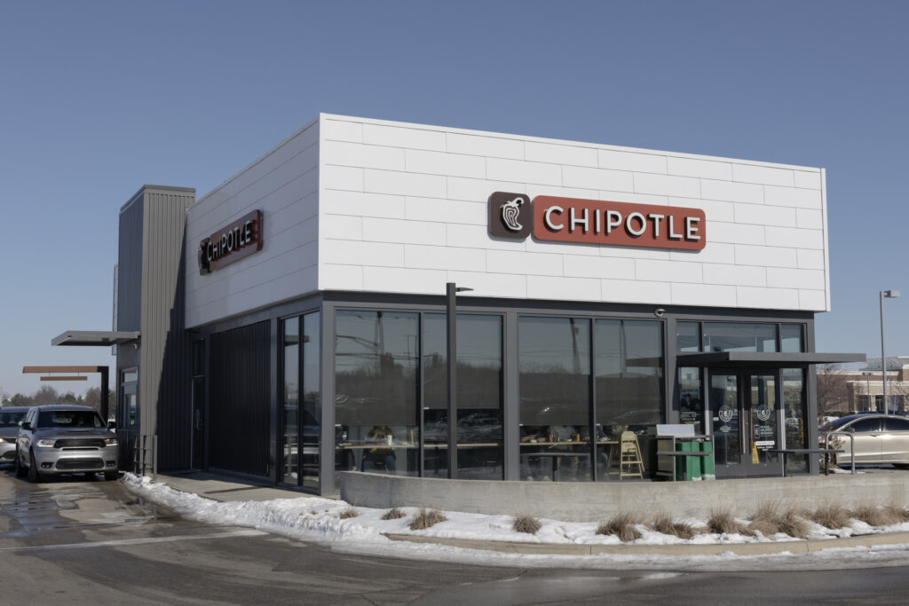 : Chipotle Mexican Grill Restaurant in snow. Chipotle is a chain of burrito and taco bowl restaurants