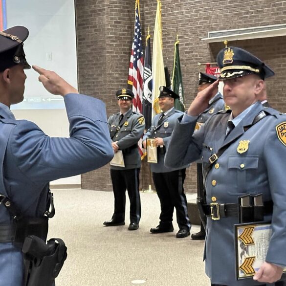 Jackson township council celebrates police department promotions and welcomes new officer - photo licensed by shore news network.