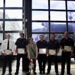 A group of Northborough firefighters received top honors this week after pulling a woman and her dog from freezing mud and ice in a dramatic February rescue that occurred just one day after completing ice rescue training.