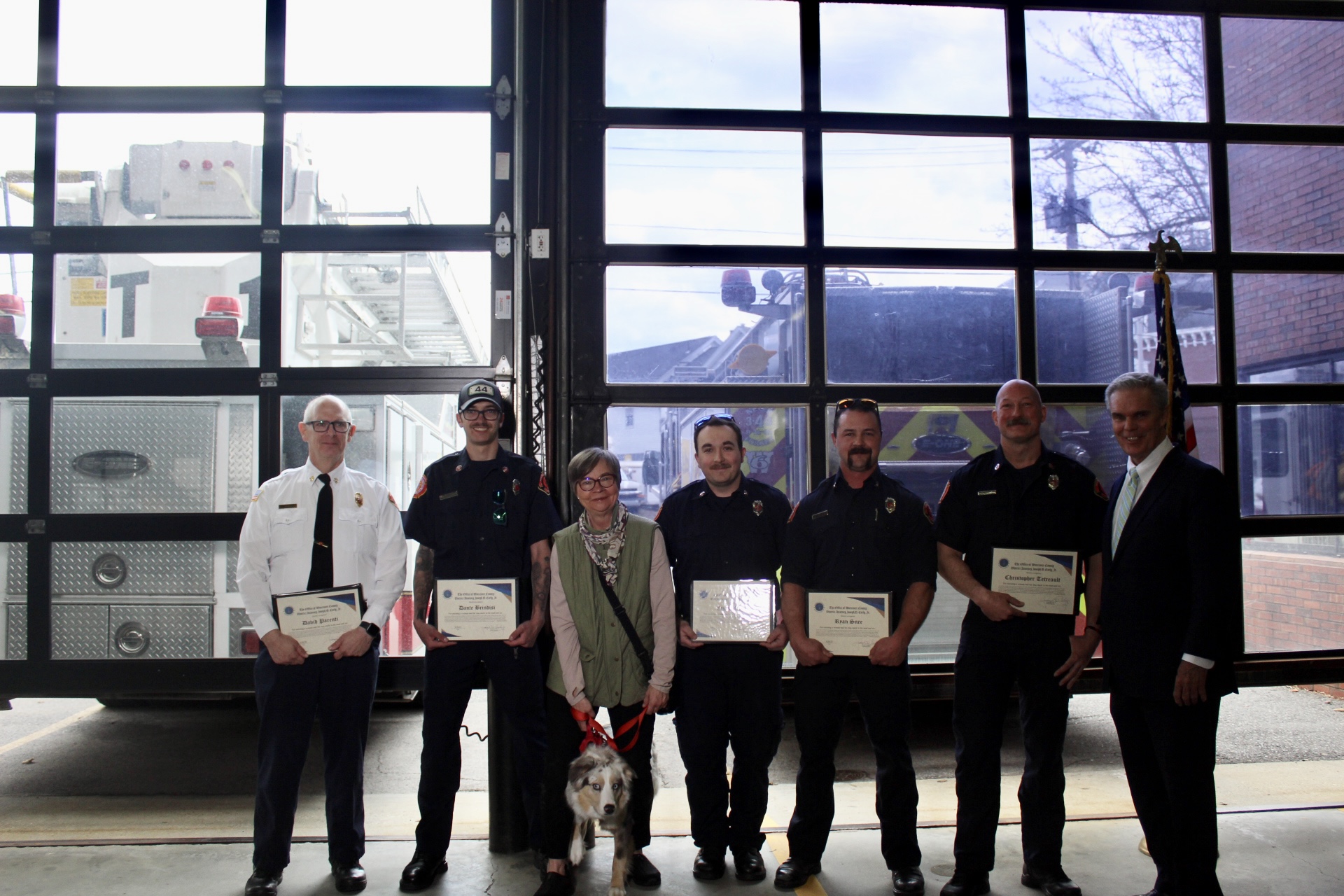 A group of Northborough firefighters received top honors this week after pulling a woman and her dog from freezing mud and ice in a dramatic February rescue that occurred just one day after completing ice rescue training.