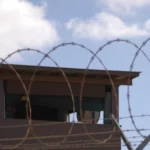 GUANTANAMO BAY, CUBA 12.31.2009 Photo by Spc. Cody Black U.S. Navy Subscribe304 facebook sharing buttontwitter sharing buttonlinkedin sharing buttonsharethis sharing button A Soldier stands guard in a tower at Camp Delta at Joint Task Force Guantanamo Bay. (U.S. Army photo by Spc. Cody Black)