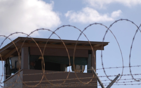 GUANTANAMO BAY, CUBA 12.31.2009 Photo by Spc. Cody Black U.S. Navy Subscribe304 facebook sharing buttontwitter sharing buttonlinkedin sharing buttonsharethis sharing button A Soldier stands guard in a tower at Camp Delta at Joint Task Force Guantanamo Bay. (U.S. Army photo by Spc. Cody Black)