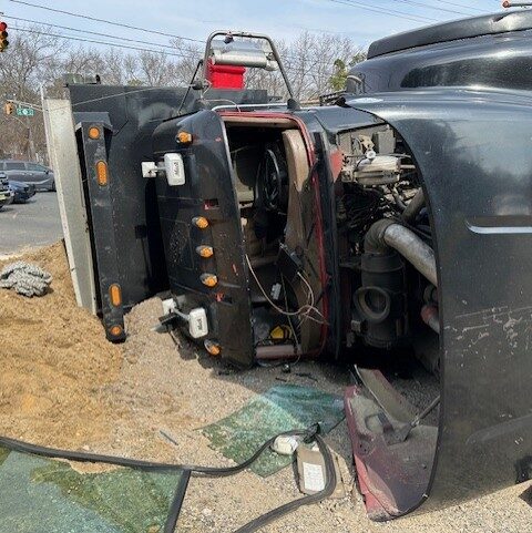 Dump truck crash outside ocean county garbage dump caused by speeding, police report - photo licensed by shore news network.