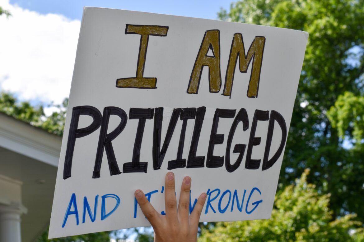 A High School Student Holding Up A Sign That Says I Am Privileged And It`s Wrong To Support Black Lives. Westfield, NJ: 06/07/20: A High School Student Holding Up A Sign That Says I Am Privileged And It`s Wrong To Support The Black Lives Matter Movement At A Protest For George Floyd`s Death.