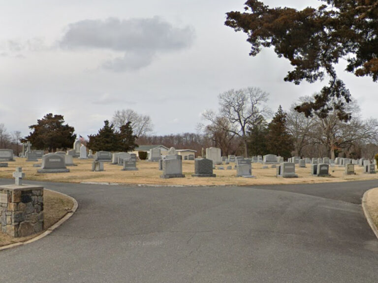 Car crashes into cemetery, strikes gravestones in wall township - photo licensed by shore news network.