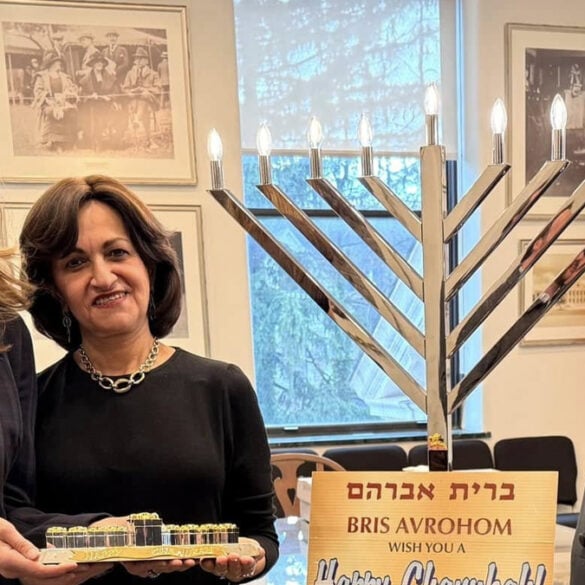 Campaign photo of congresswoman mikie sherril meeting with jewish community members during the hannukah holiday.