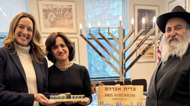 Campaign photo of congresswoman mikie sherril meeting with jewish community members during the hannukah holiday.