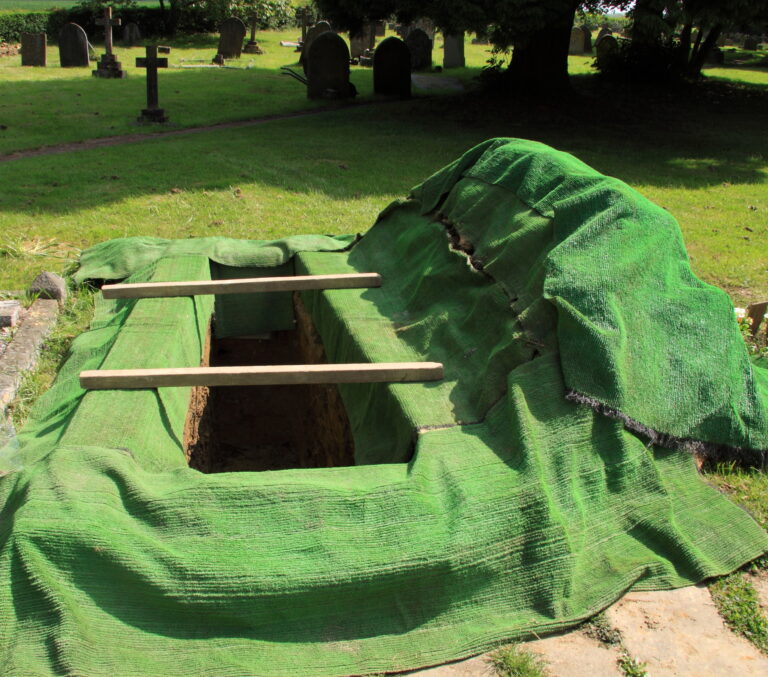 West virginia gravedigger arrested after baby’s corpse found exposed, casket dumped over hill - photo licensed by shore news network.