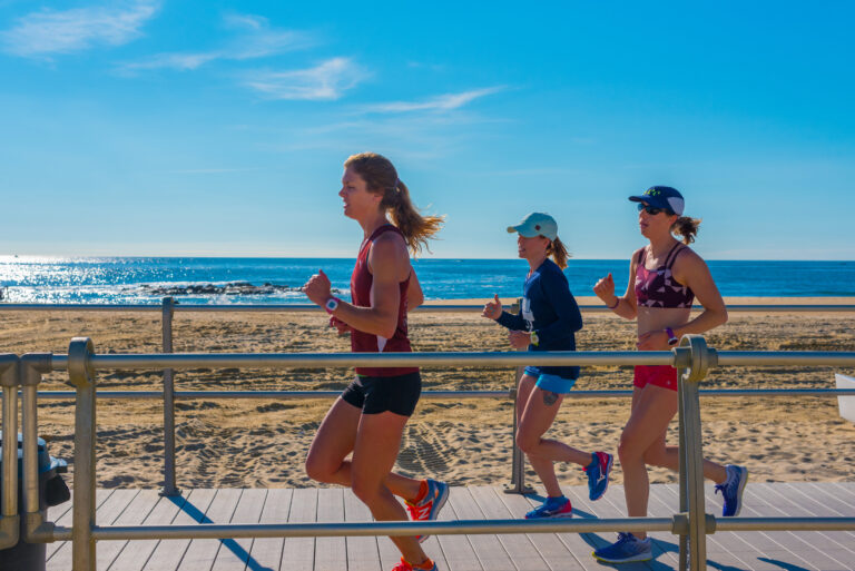 Women jogging on the boardwalk.