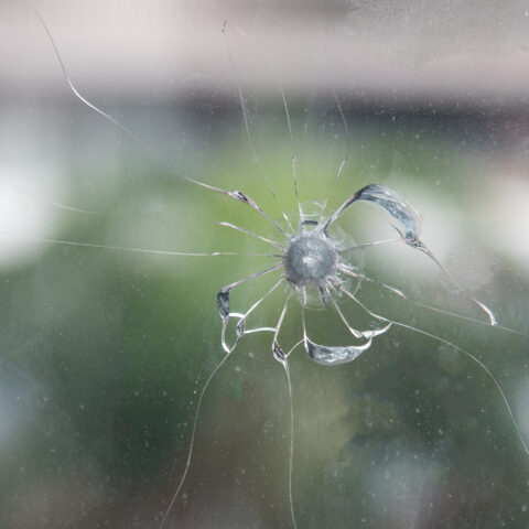 Bullet hole in window