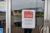 A sign in a window of a business shutdown during the COVID-19 pandemic