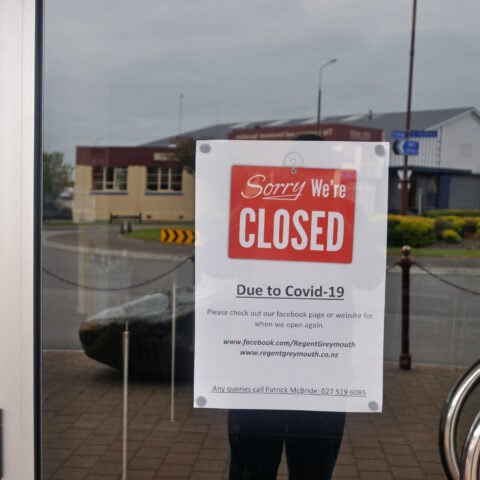 A sign in a window of a business shutdown during the covid-19 pandemic