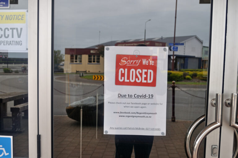 A sign in a window of a business shutdown during the covid-19 pandemic