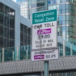 Congestion prices signage in Lower Manhattan at the entrance to the Congestion Relief Zone on the first day of its implementation in New YorkCongestion prices signage in Lower Manhattan at the entrance to the Congestion Relief Zone on the first day of its implementation in New York
