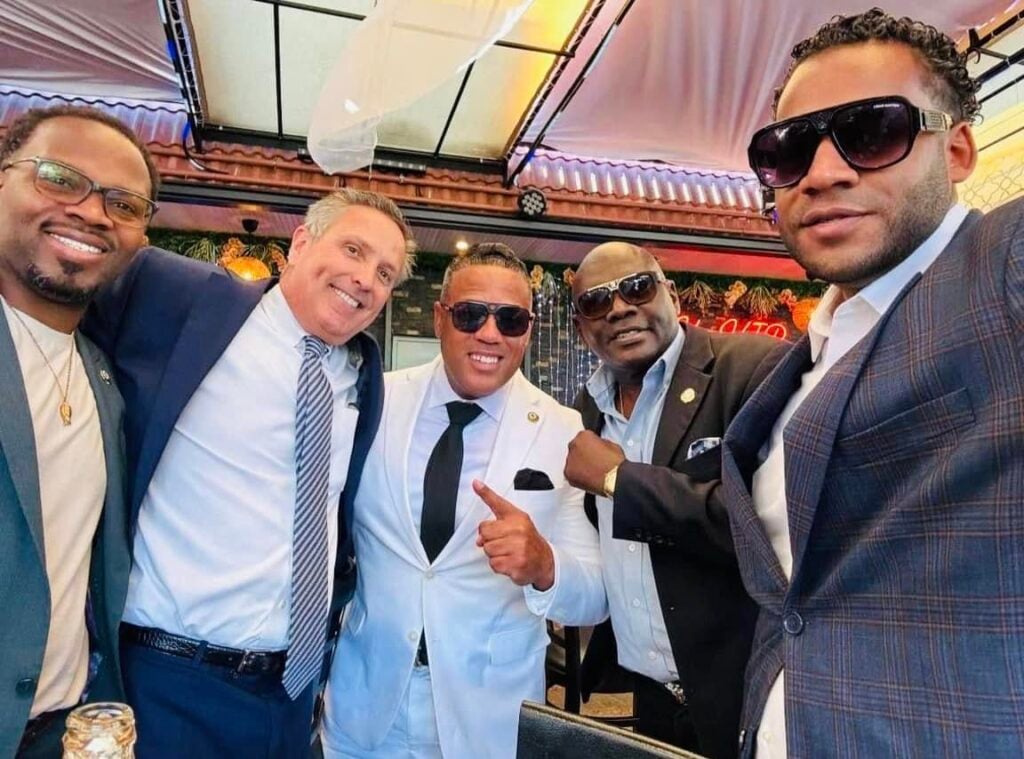 Alex Mendez (white suit) in a campaign photo.