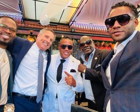 Alex Mendez (white suit) in a campaign photo.