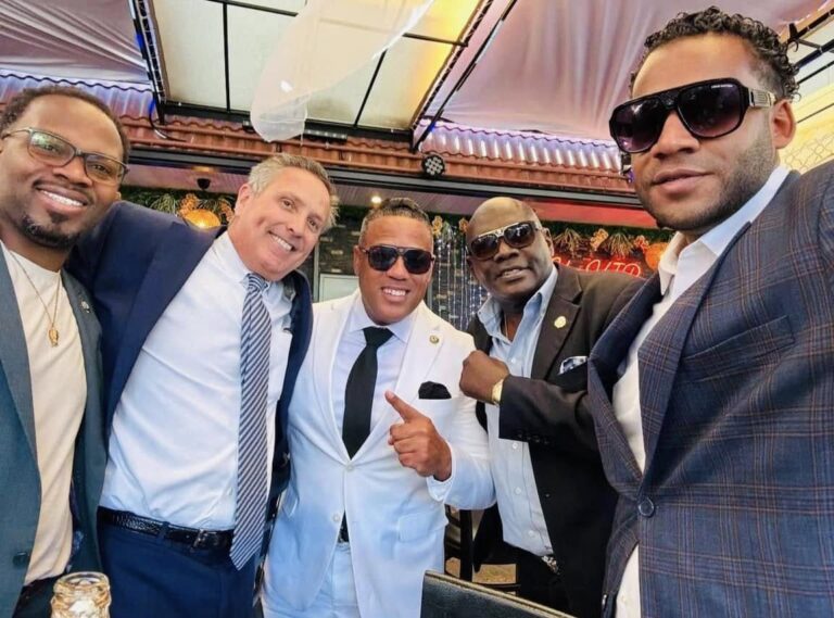 Alex mendez (white suit) in a campaign photo.