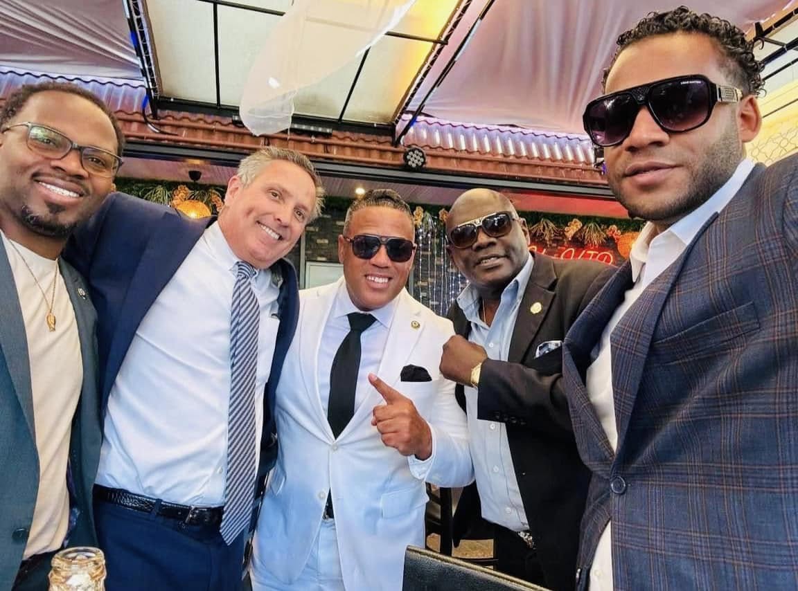 Alex Mendez (white suit) in a campaign photo.