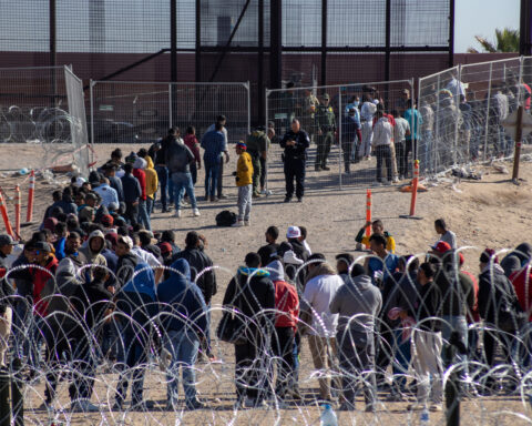 Migrants crossing U.S. border during Biden administration.