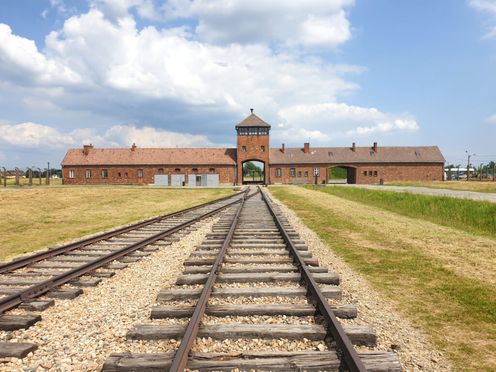Workers behind the Barstool Philadelphia "F Jews" sign being sent to concentration camp