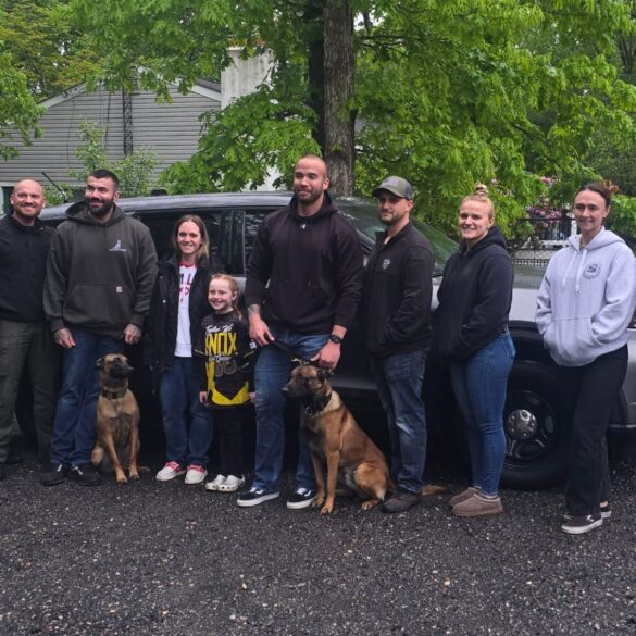 Police officers, k9 units visit young jersey girl after father's passing - photo licensed by shore news network.