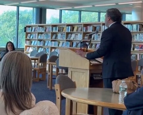 Bill Spadea speaks with educators as his campaign consultant, George Gilmore, a once-convicted felon supervises.