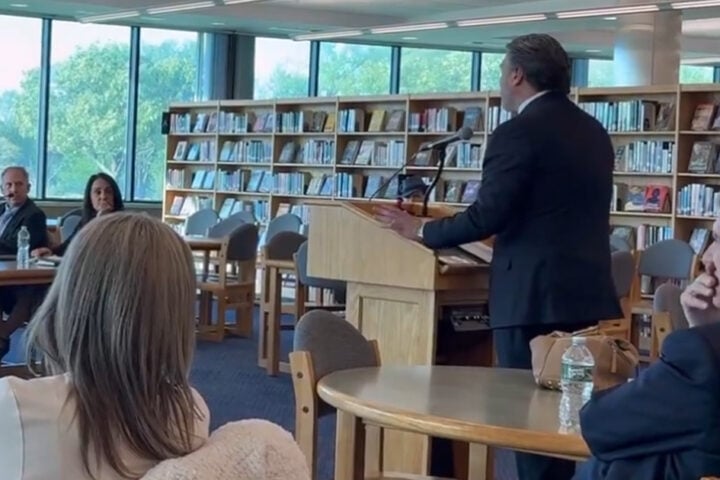 Bill Spadea speaks with educators as his campaign consultant, George Gilmore, a once-convicted felon supervises.
