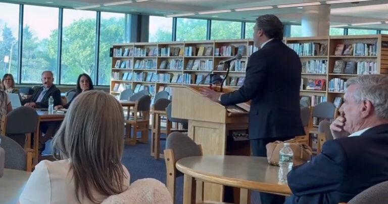 Bill spadea speaks with educators as his campaign consultant, george gilmore, a once-convicted felon supervises.