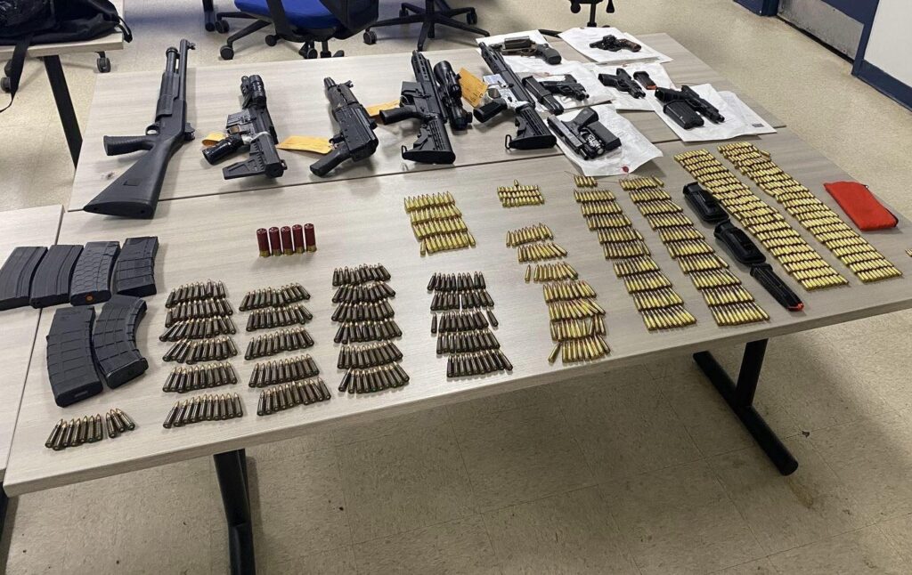 Cops: Man robs victim for shoes, hoards firearms