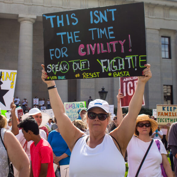 Ice protester in los angeles absolutely wrecked by nfl quality tackle by innocent bystander - photo licensed by shore news network.