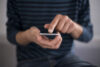 Man texting - file photo