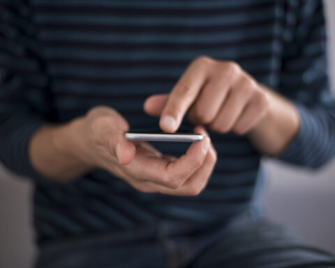 Man texting - File Photo