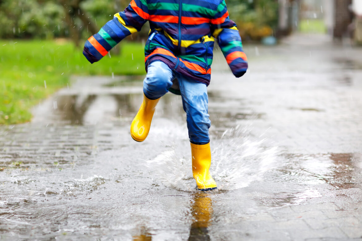A child playing in the rain - File Photo