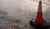 Traffic cone in flooded road