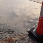 Traffic cone in flooded road